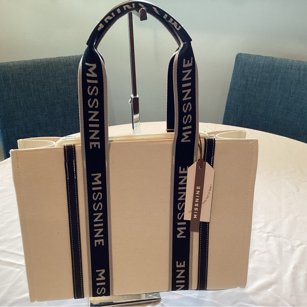 MissNine cream and black tote bag